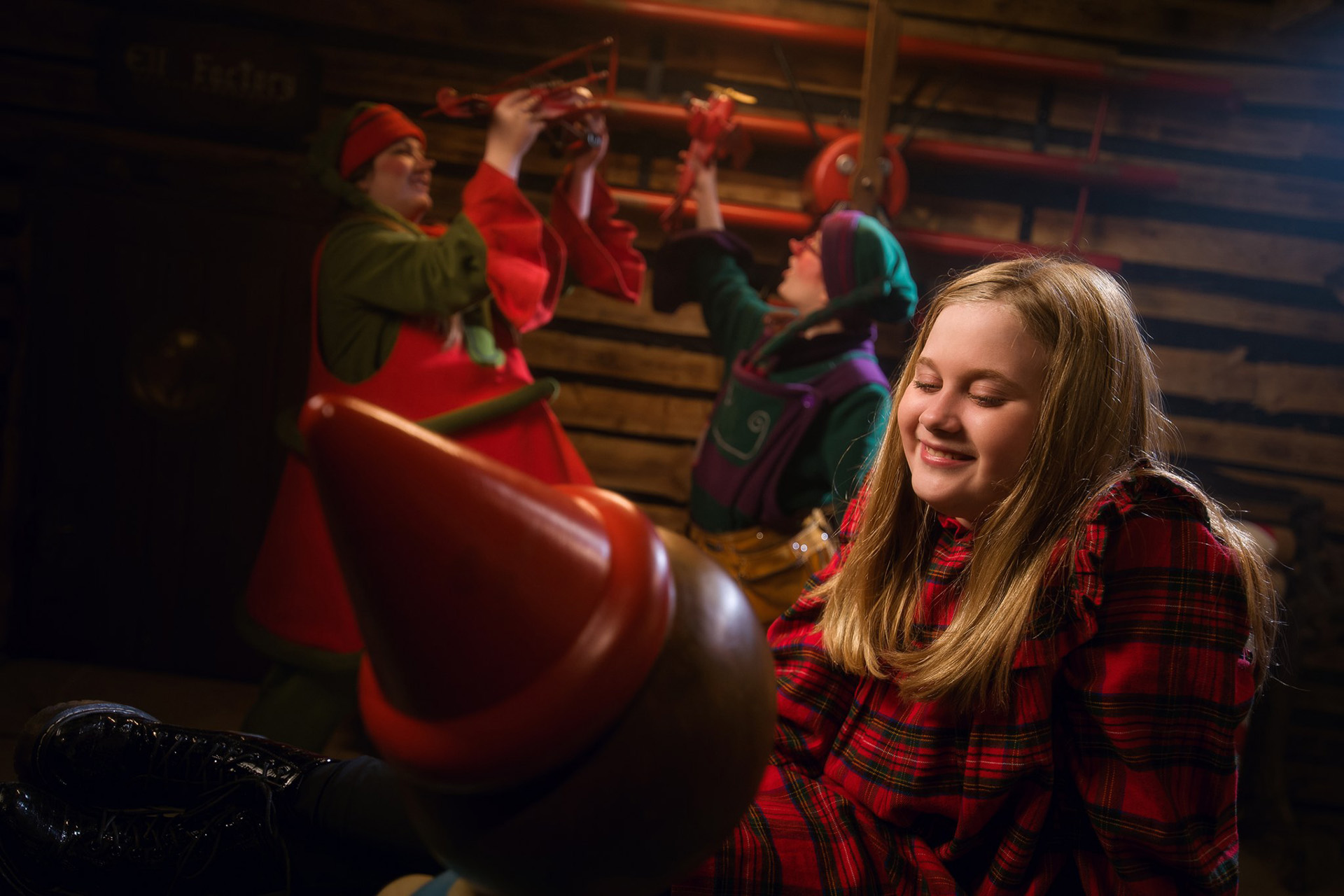 Elves and child in the Toy Factory of the Santa Claus Secret Forest Joulukka.