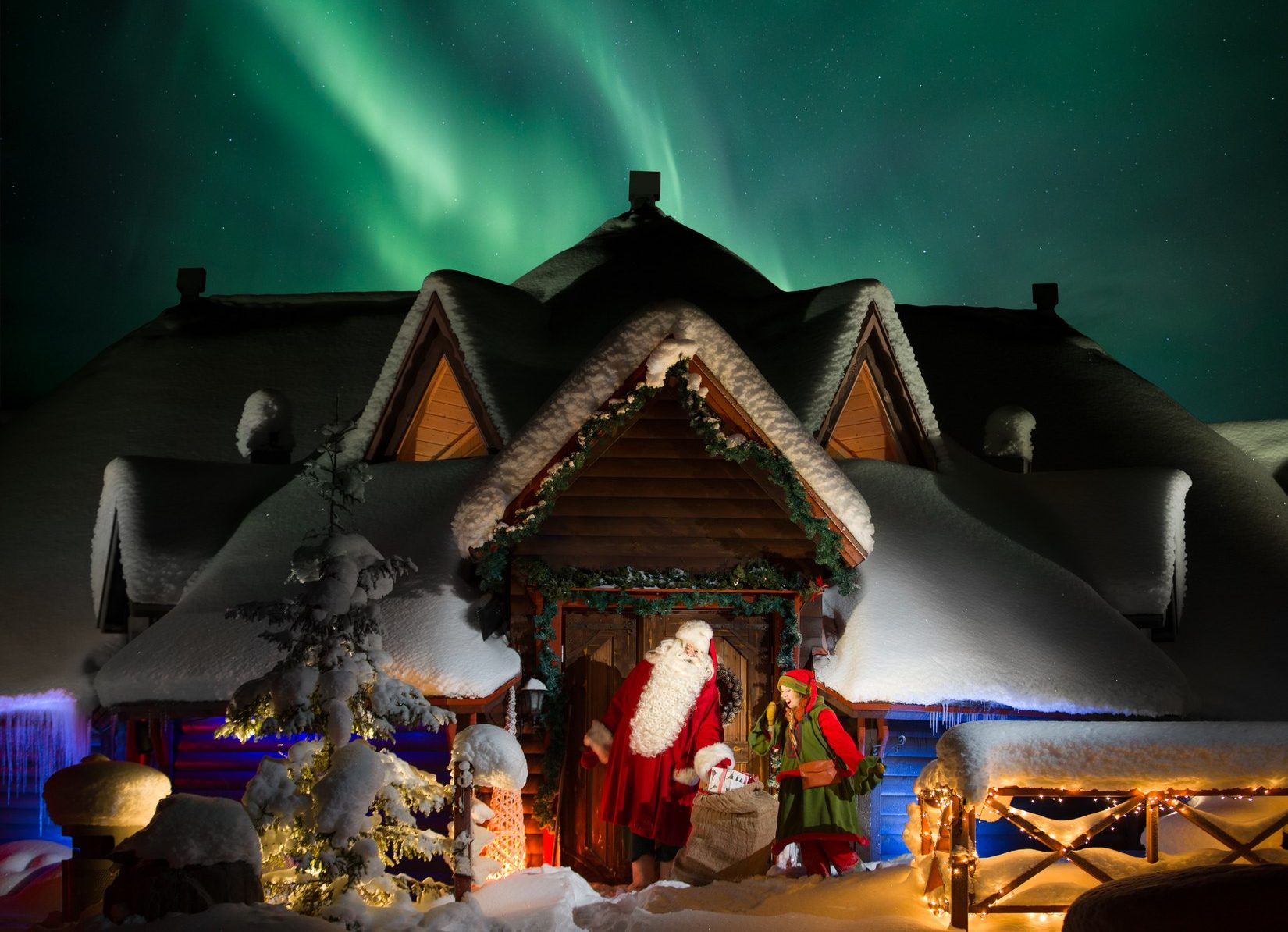 Santa and elf at IsoTokka with Northern Lights