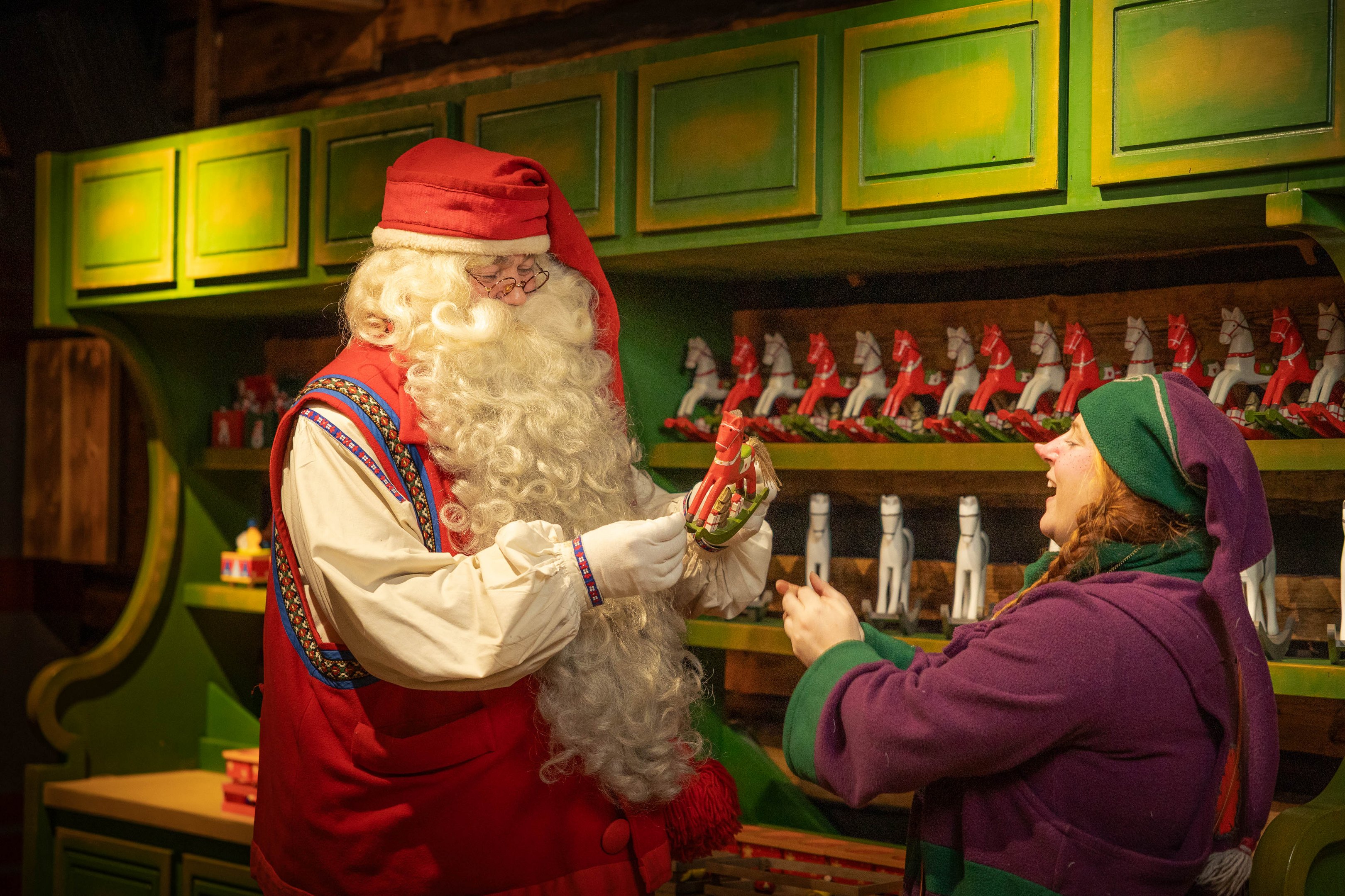 Santa Claus in Toy Factory with Elf